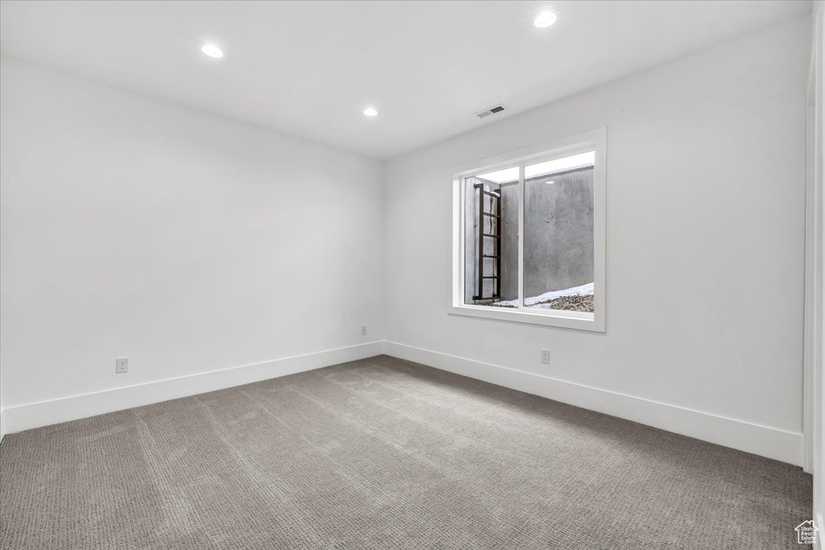 Empty room with carpet flooring