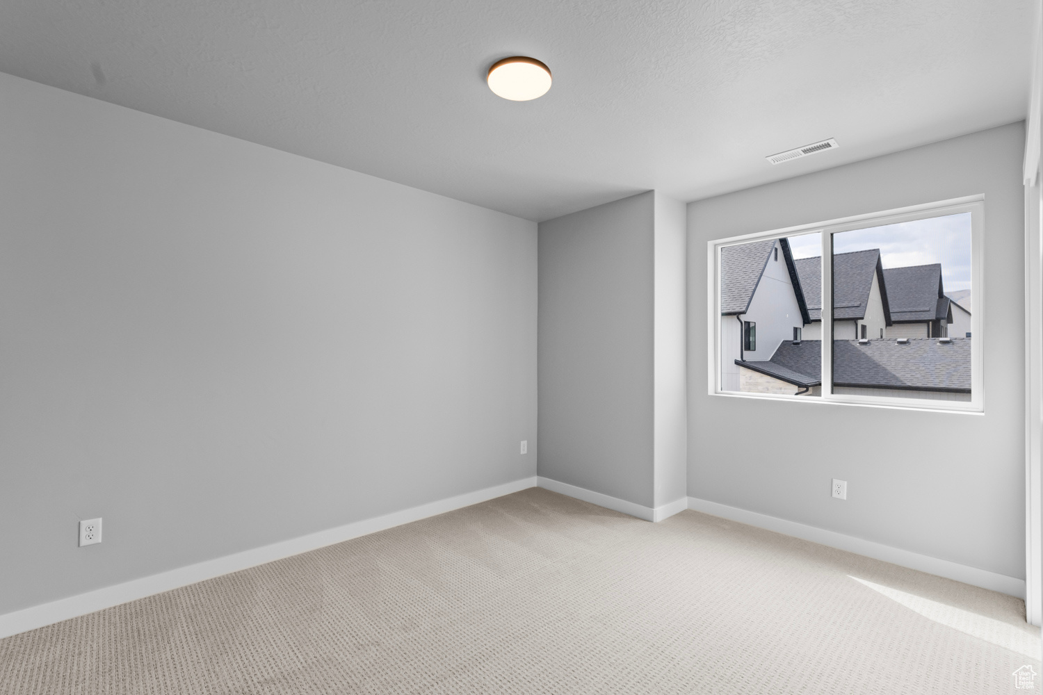 Unfurnished room featuring carpet flooring