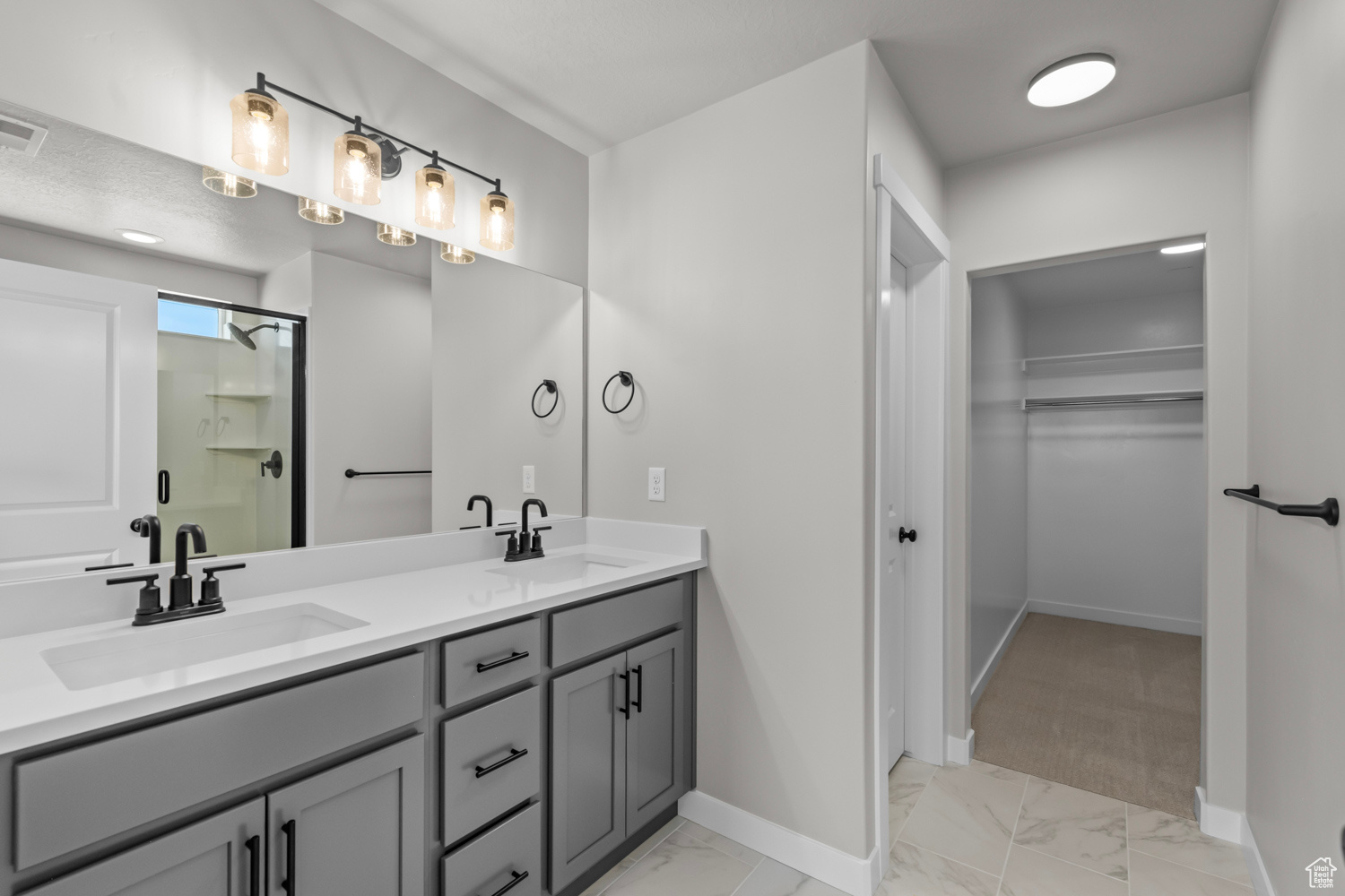 Bathroom with vanity and an enclosed shower