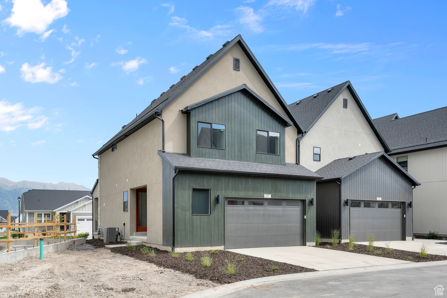 Modern farmhouse style home featuring central air condition unit and a mountain view