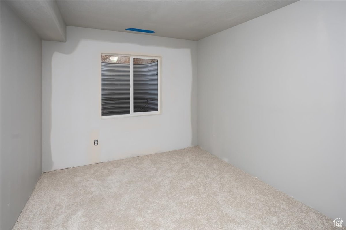 Empty room featuring carpet