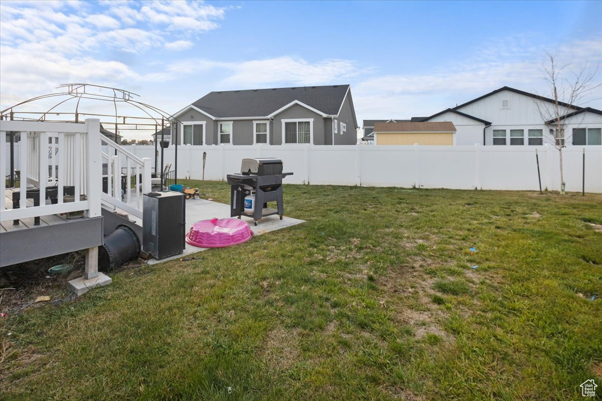 View of yard with a gazebo and a deck