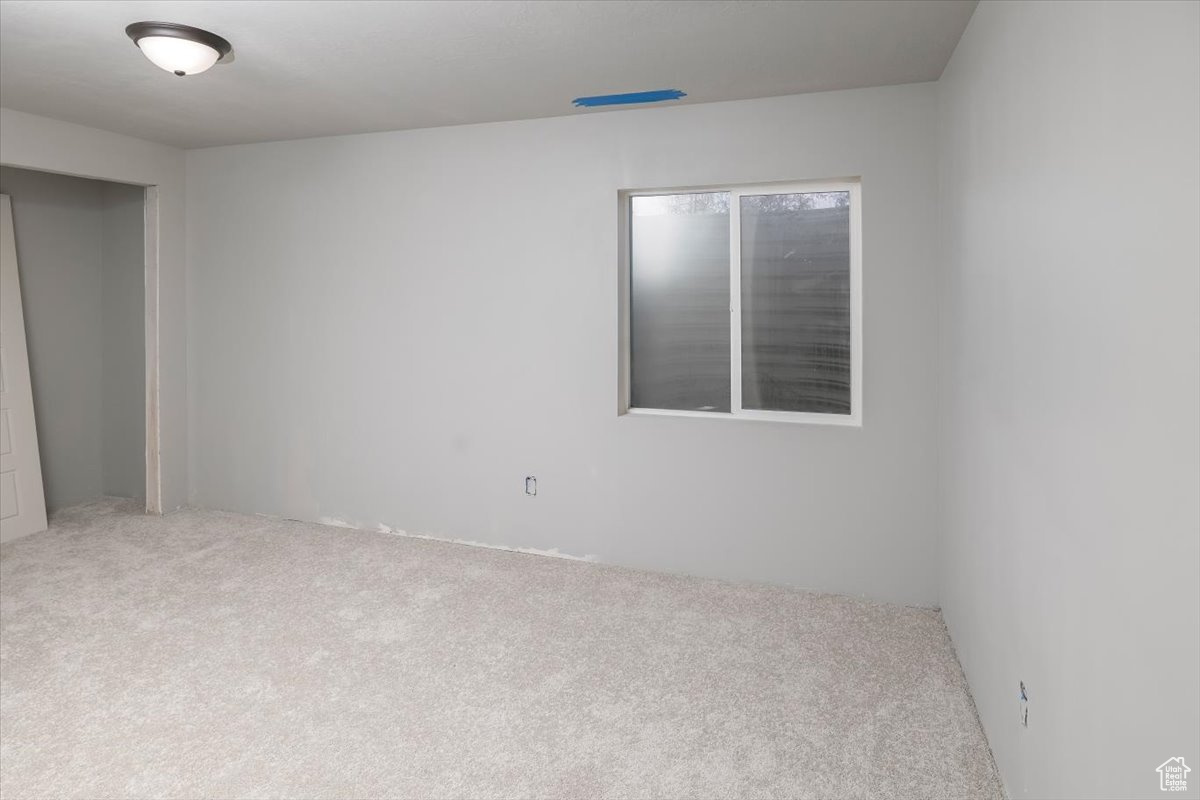 Spare room with carpet floors