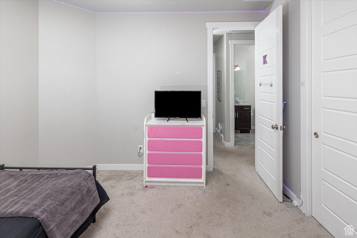 View of carpeted bedroom