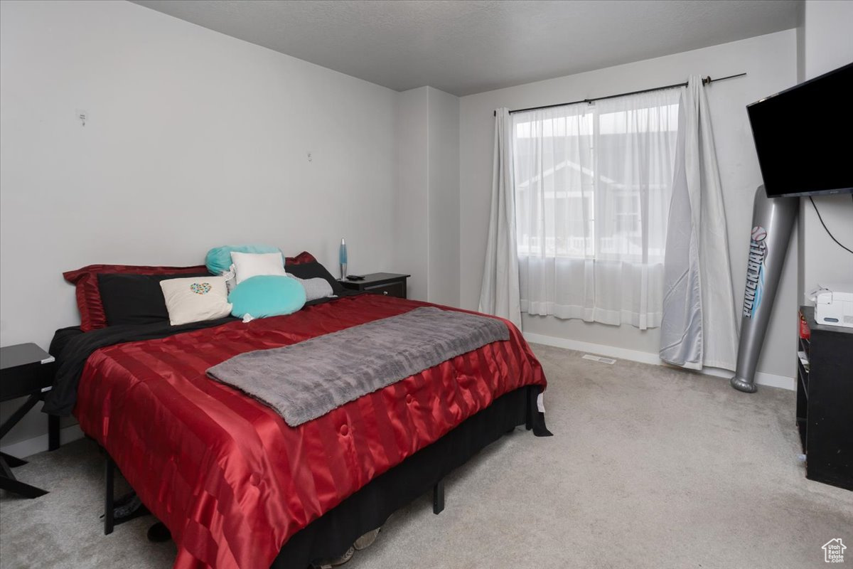 View of carpeted bedroom