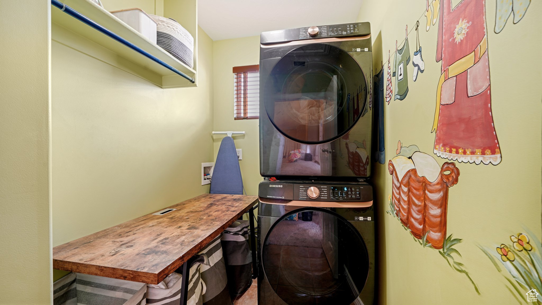 Clothes washing area with stacked washer and dryer