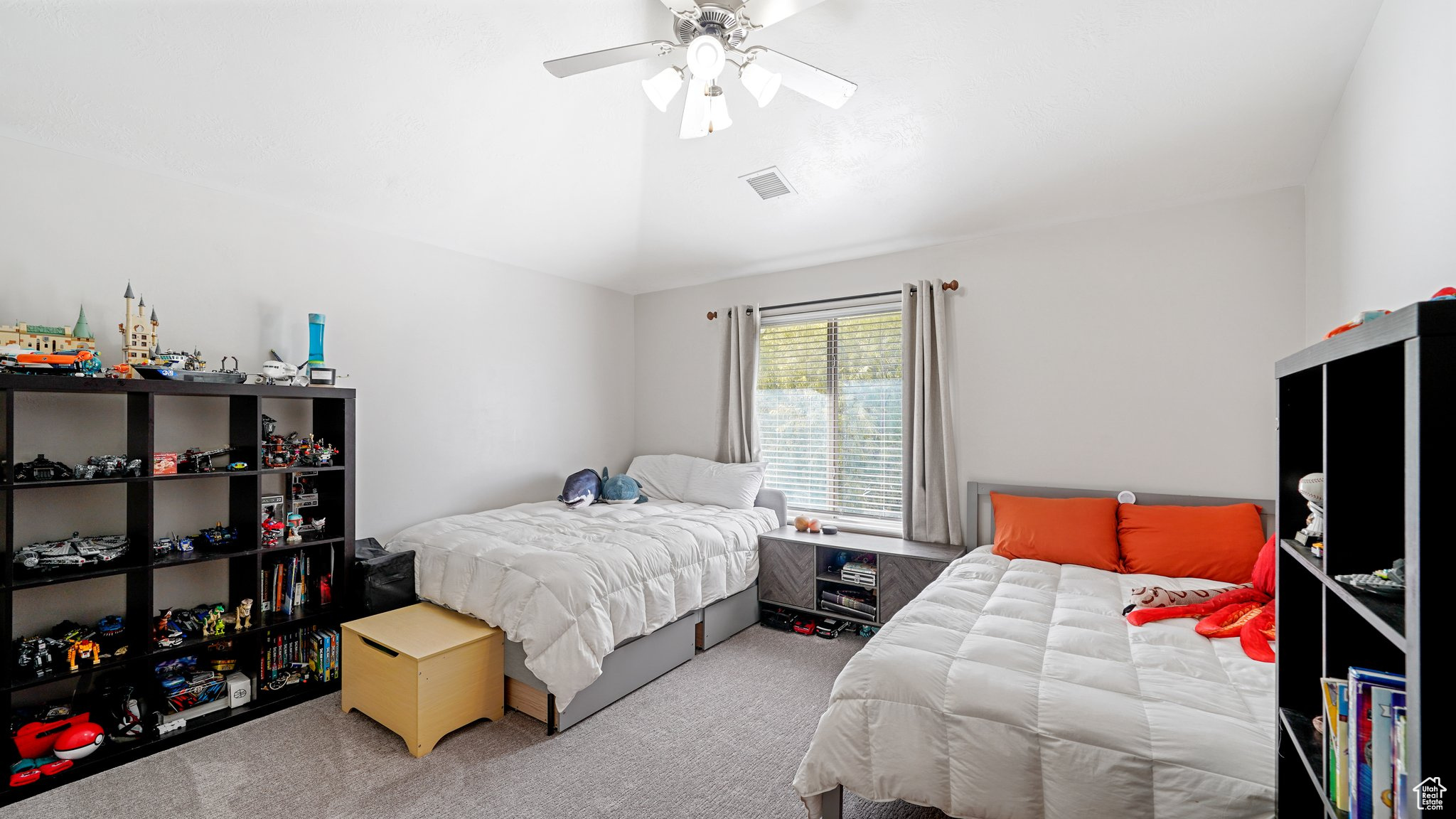 Bedroom featuring carpet floors and ceiling fan