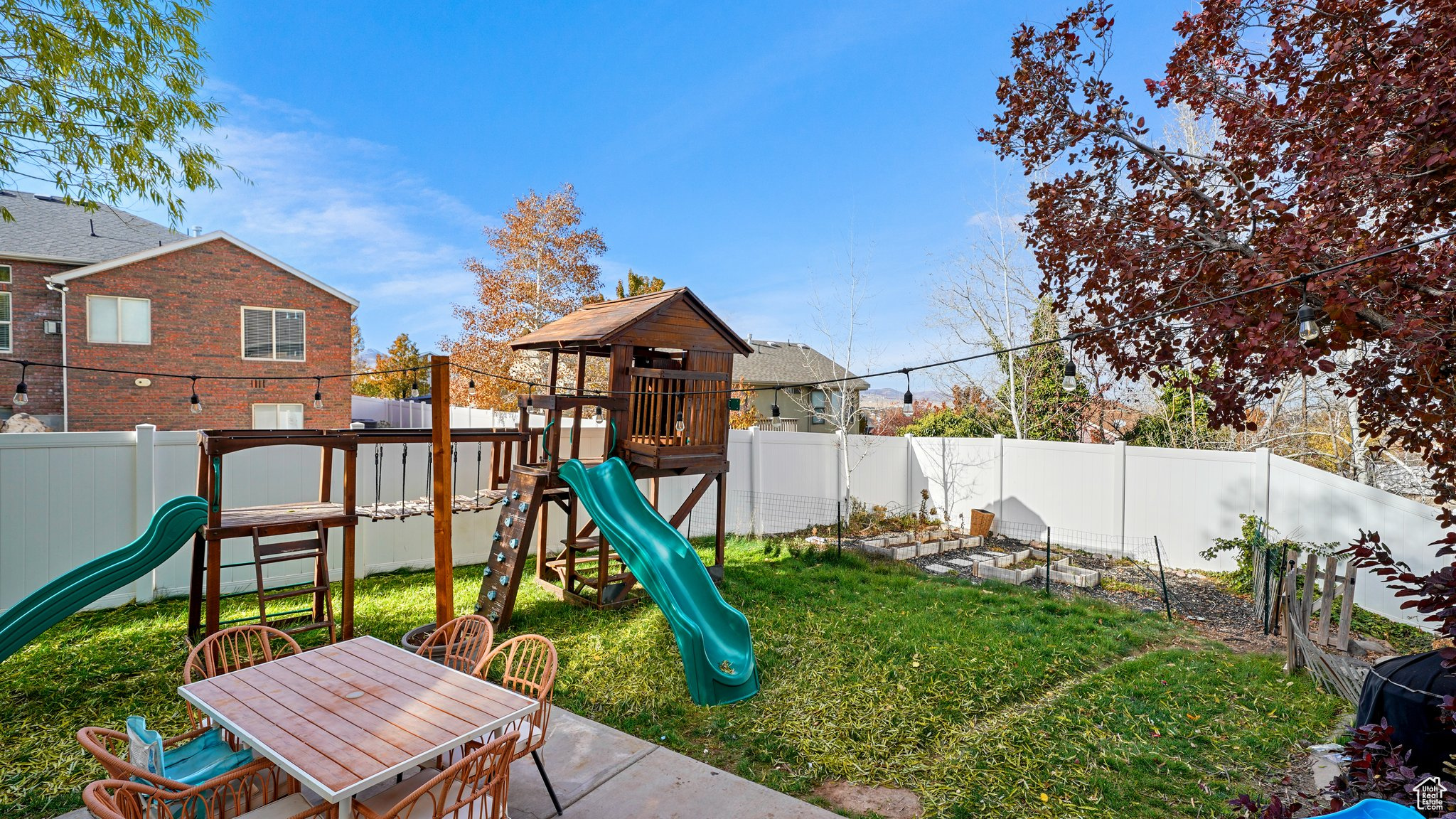 View of play area featuring a lawn