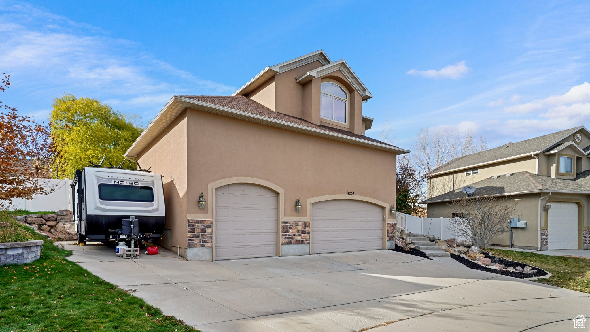 View of side of property featuring a garage