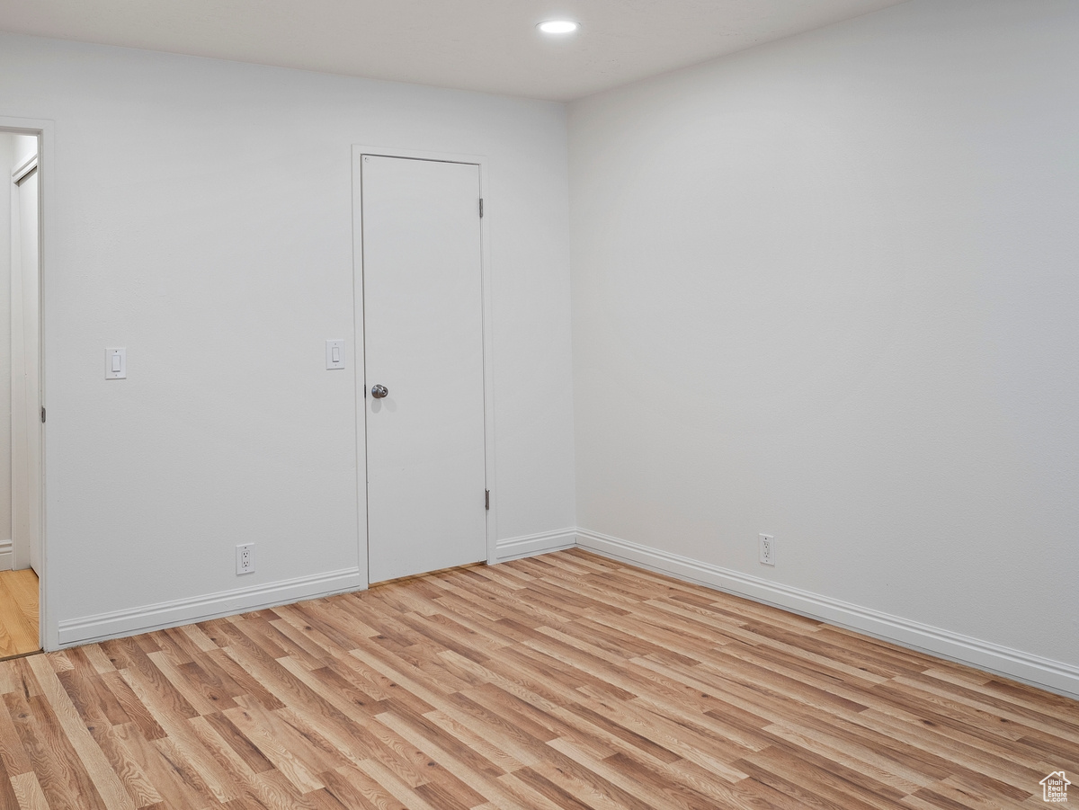 Spare room with light hardwood / wood-style floors