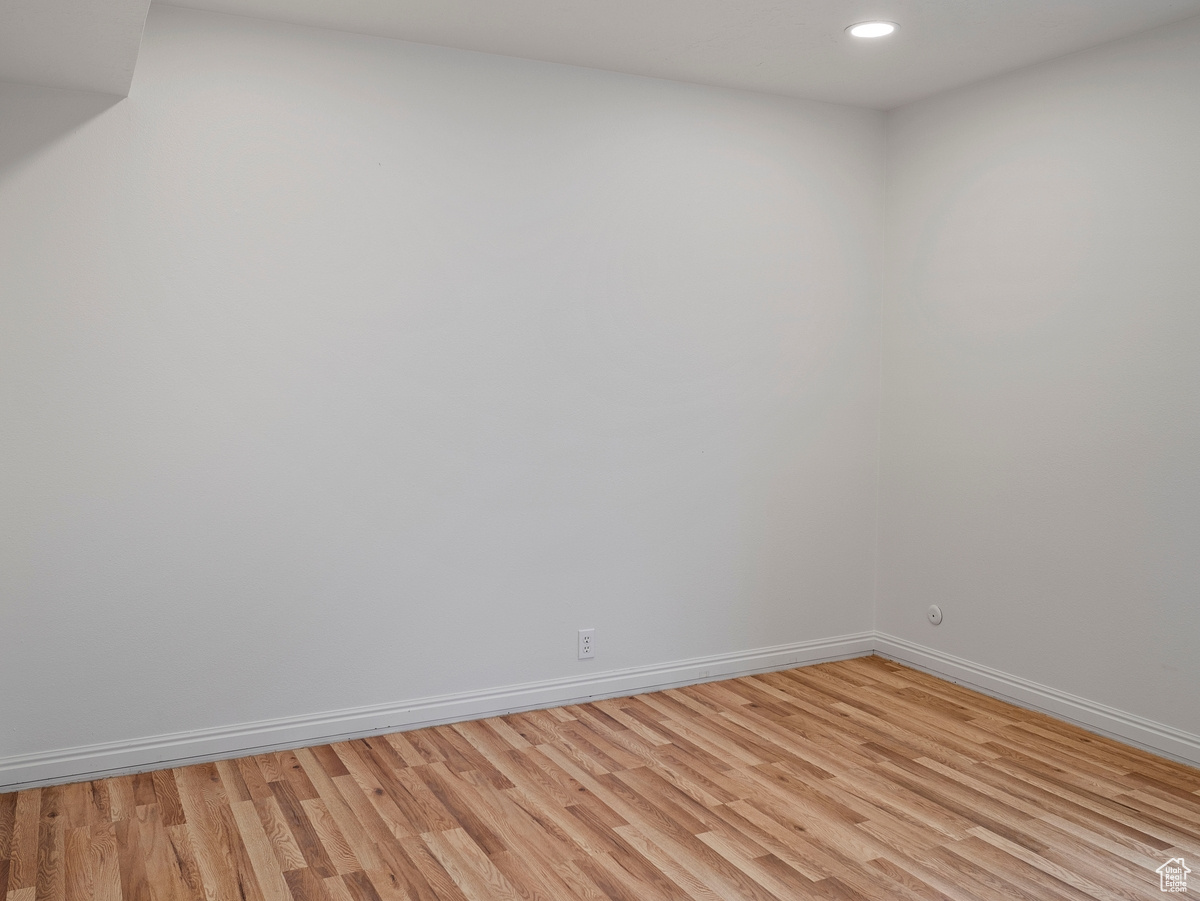 Unfurnished room with light hardwood / wood-style flooring