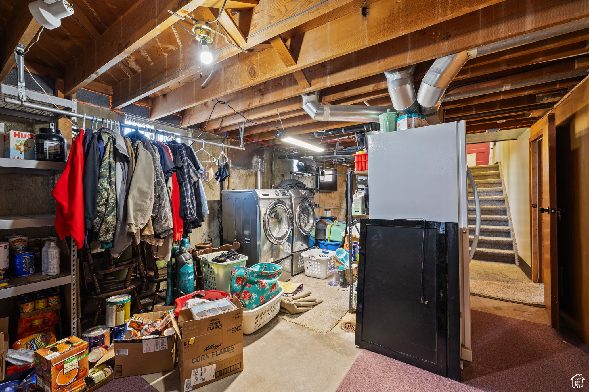 Basement featuring washer and clothes dryer