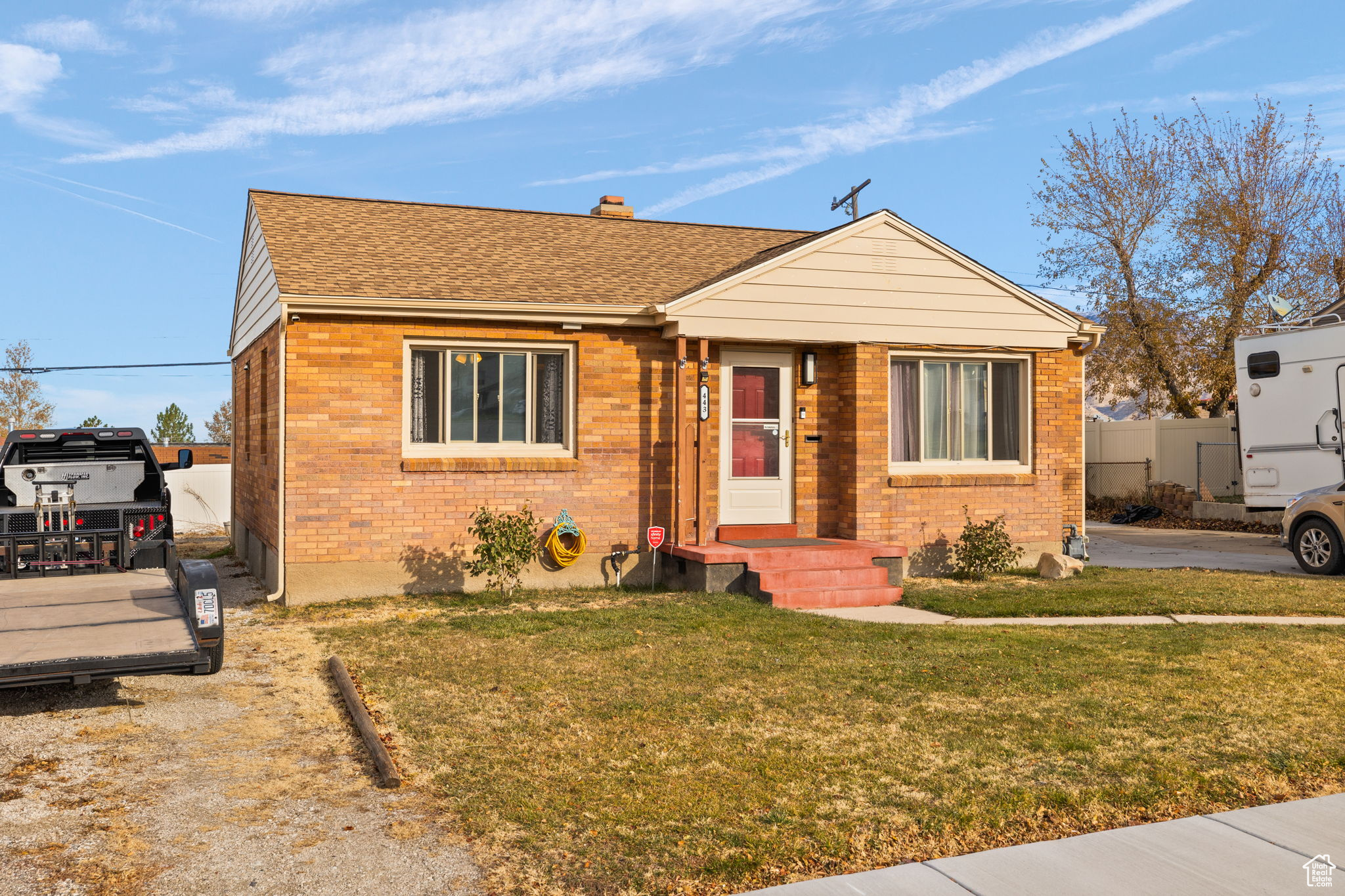 Bungalow-style home featuring a front lawn