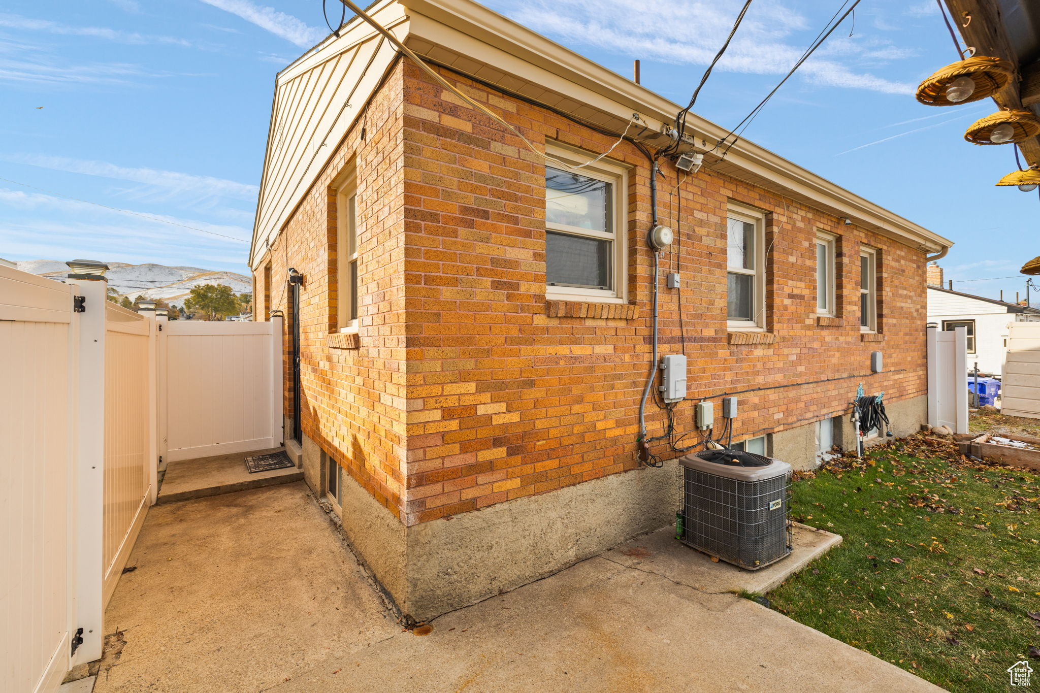 View of side of home featuring central air condition unit