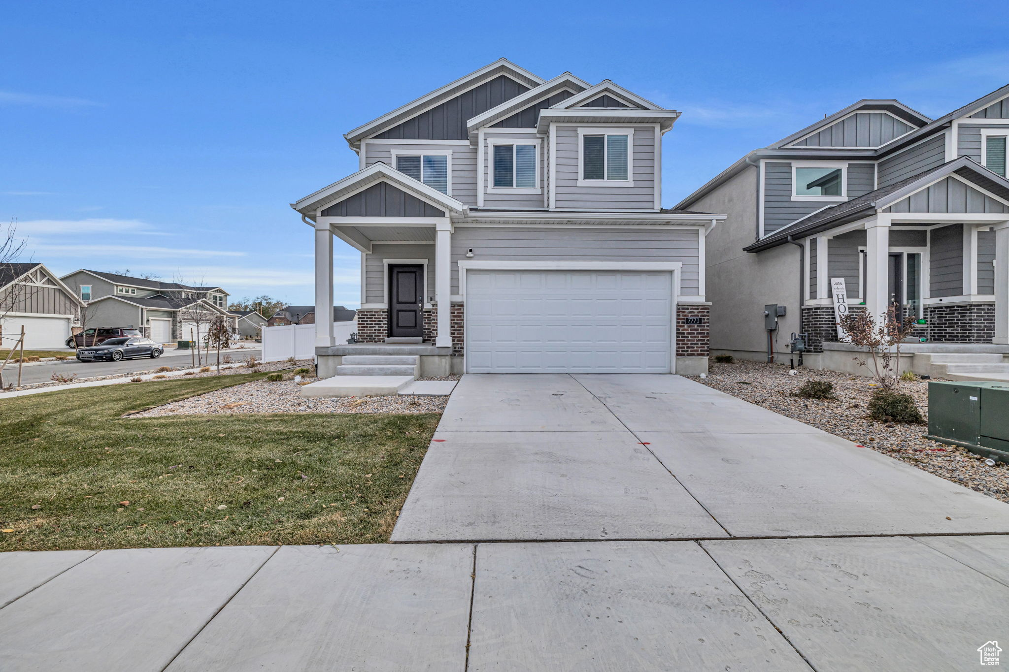 View of front facade with a garage and a front yard