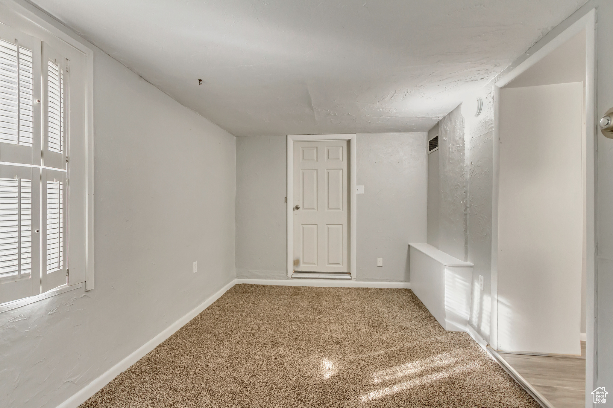 Apartment living room facing entry door