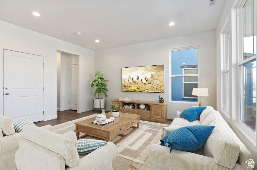 Living room with hardwood / wood-style floors