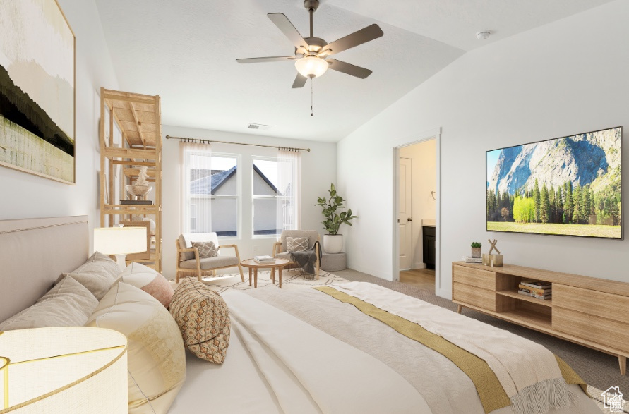 Carpeted bedroom with ensuite bath, ceiling fan, and lofted ceiling