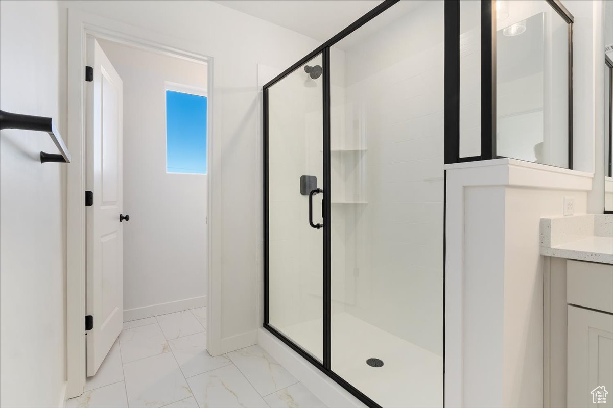 Bathroom featuring vanity and walk in shower