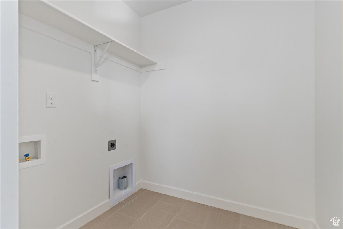 Laundry area featuring washer hookup and electric dryer hookup
