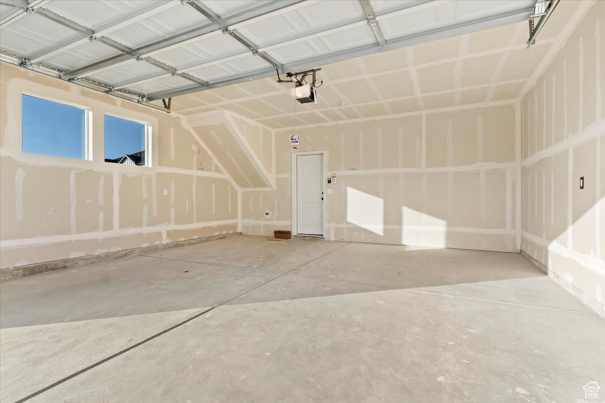 Garage featuring a garage door opener