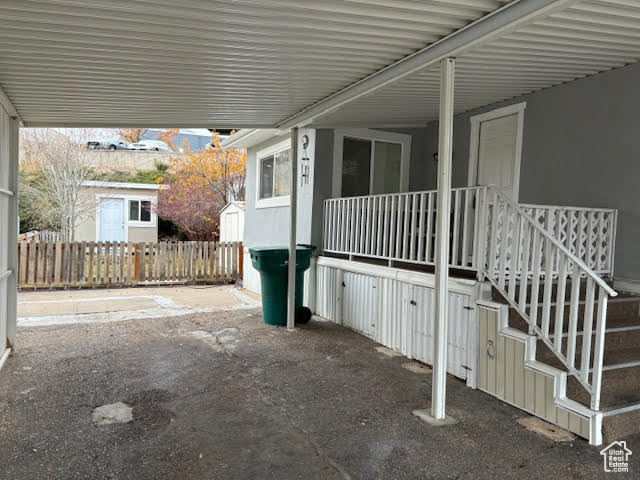 View of patio featuring a carport