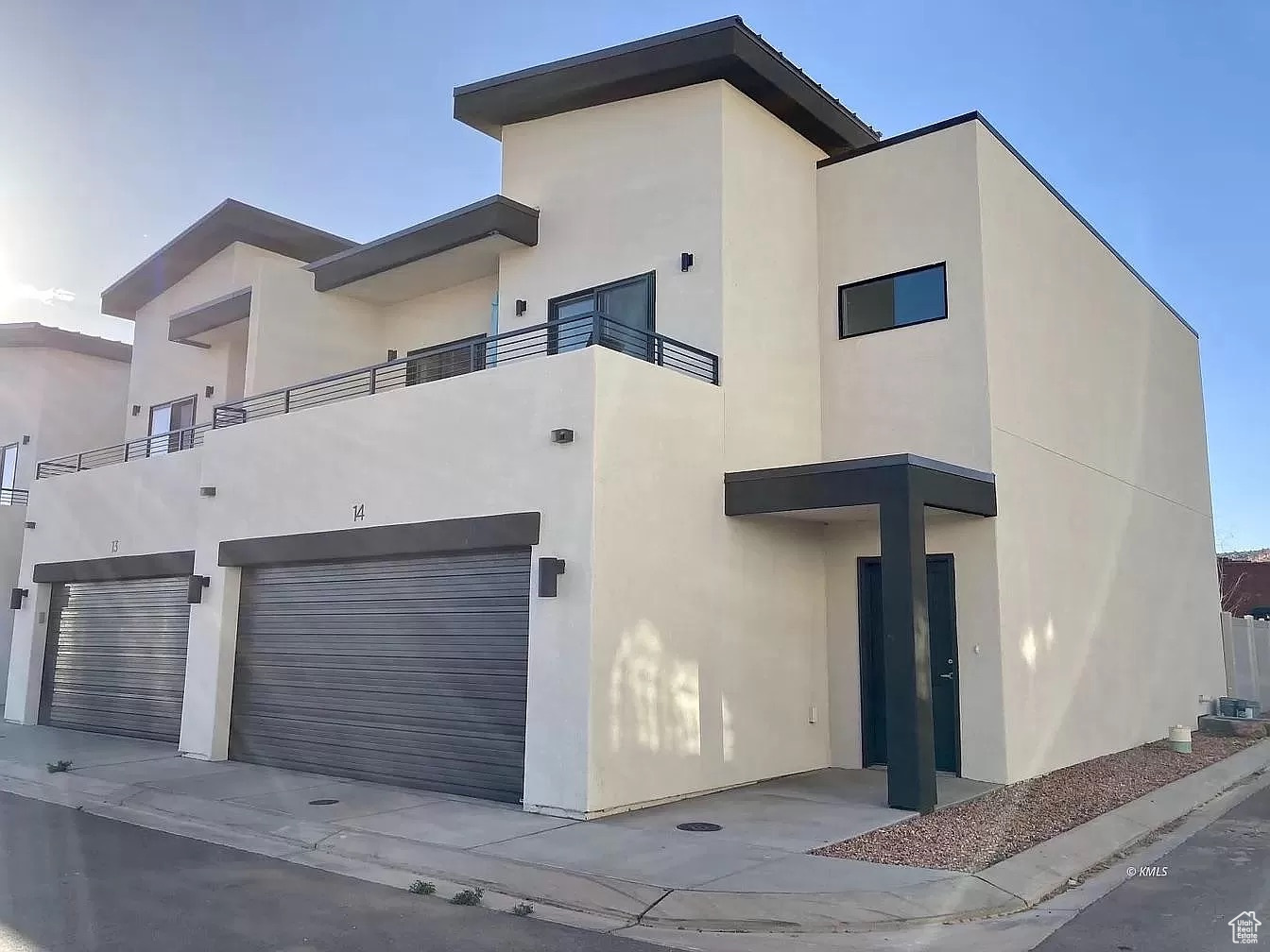 Contemporary home with a balcony and a garage