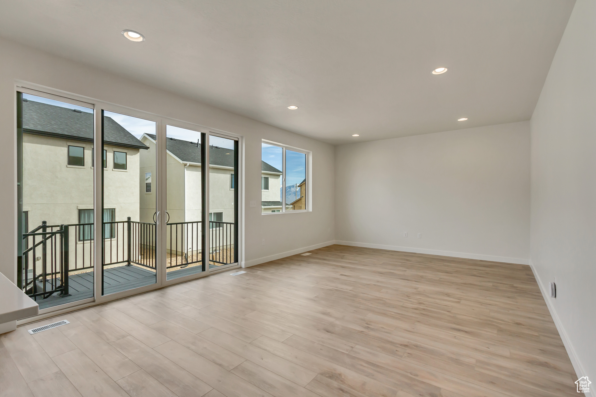 Empty room featuring light wood-type flooring