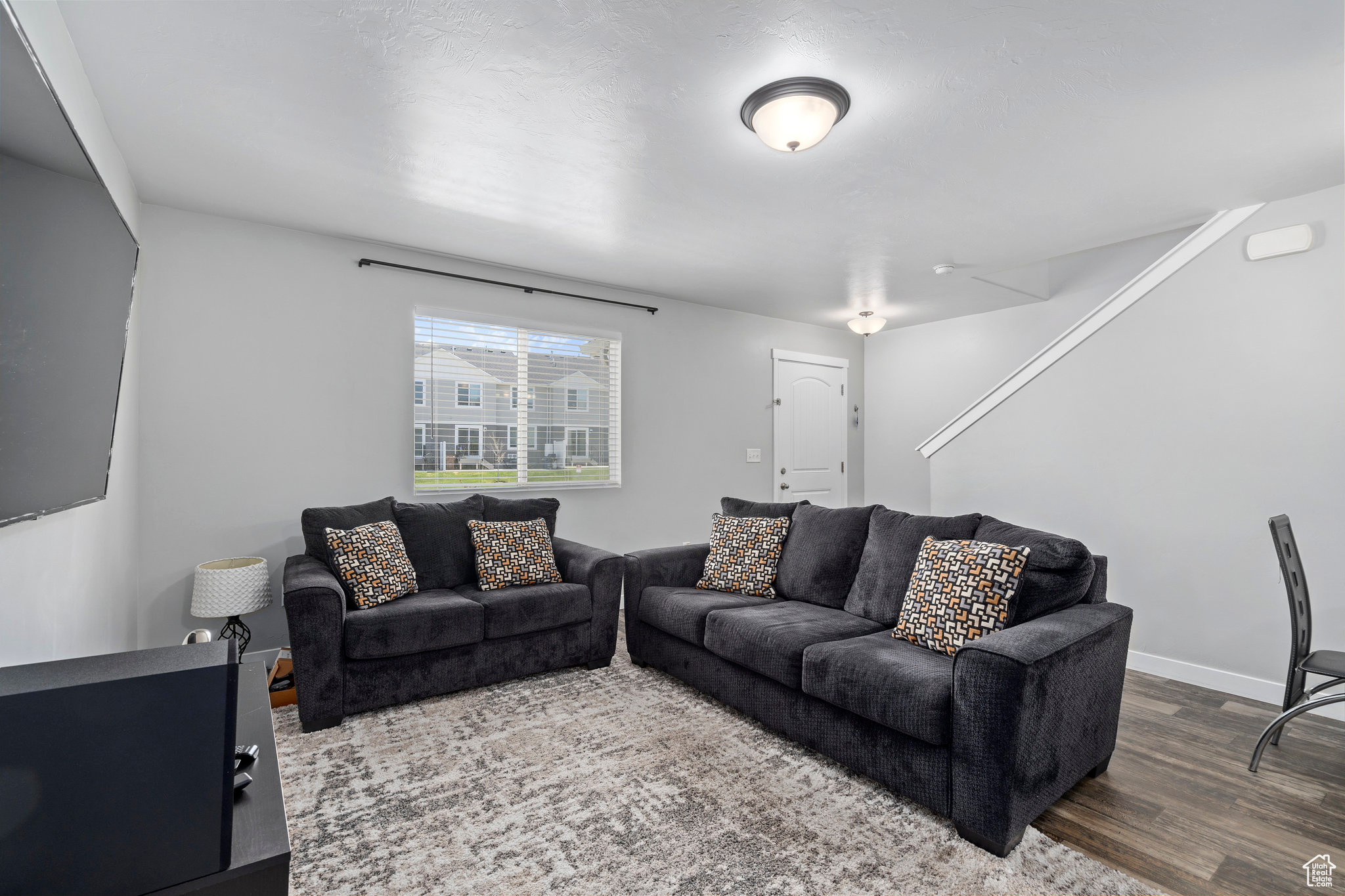 Living room with hardwood / wood-style flooring