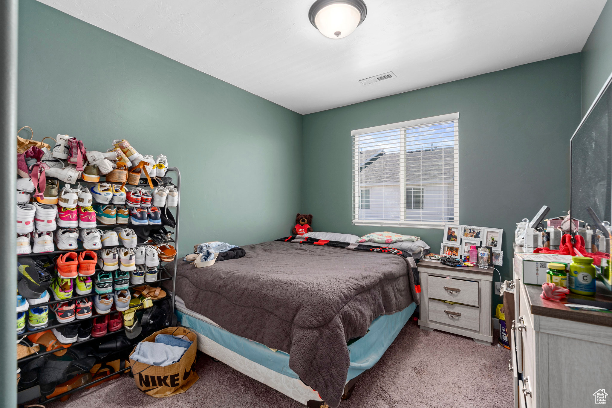 Bedroom with light carpet