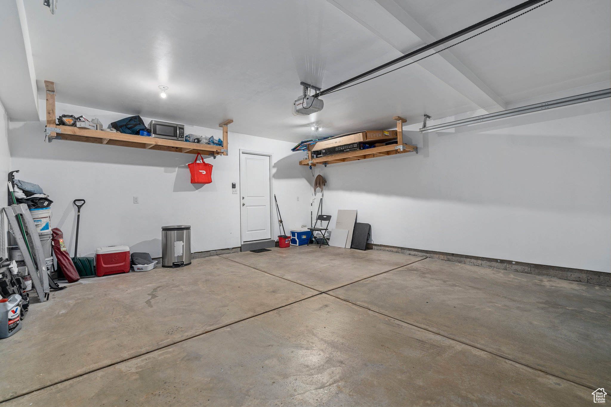 Garage featuring a garage door opener