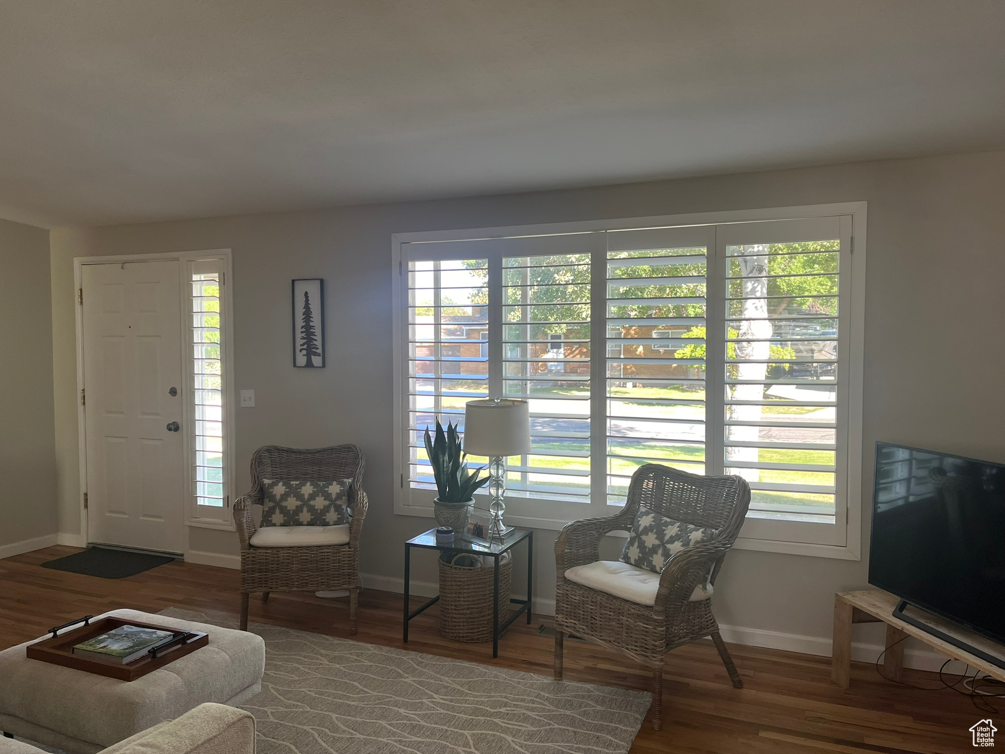 Living room featuring a wealth of natural light and wood-type flooring