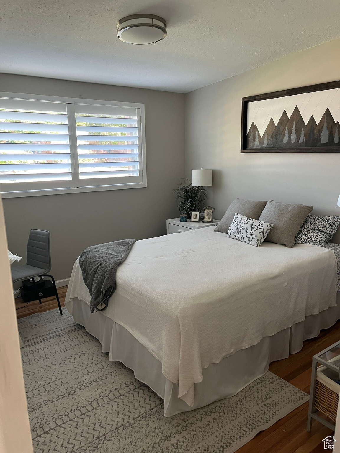 Bedroom featuring wood-type flooring