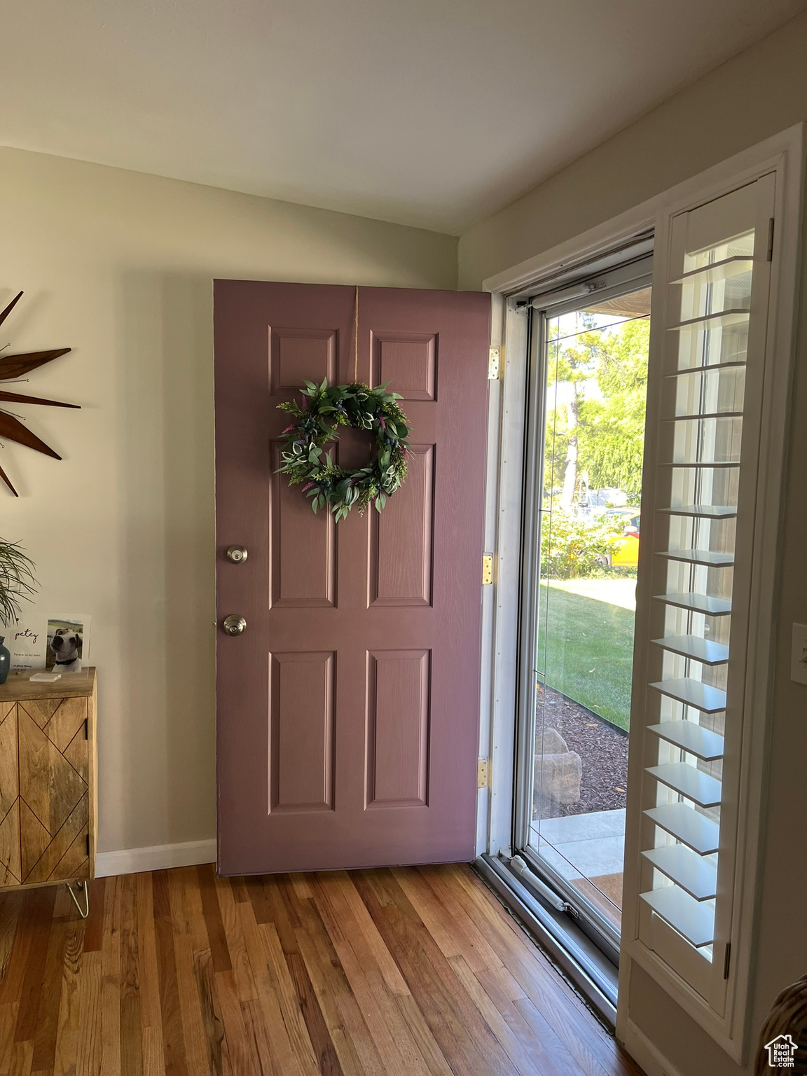 Foyer entrance featuring light hardwood / wood-style floors