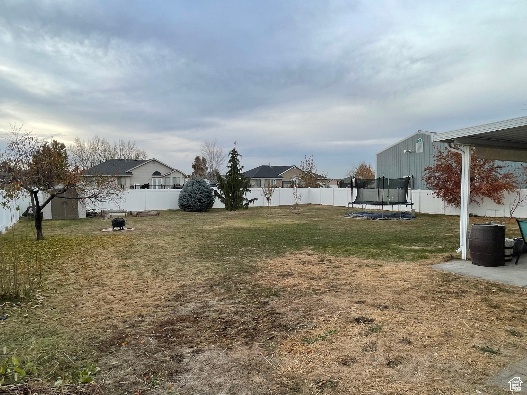 View of yard featuring a trampoline