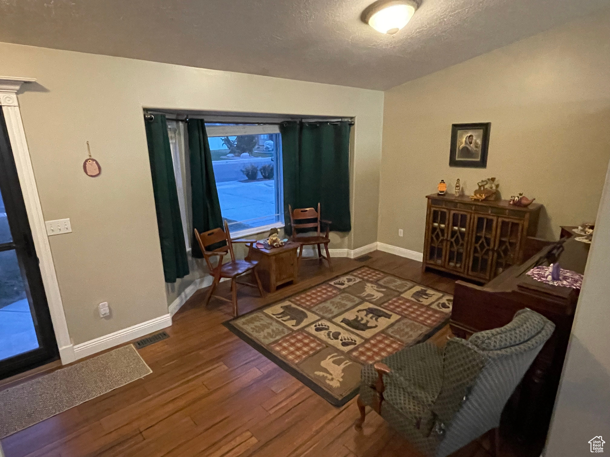 Living room with dark hardwood / wood-style floors