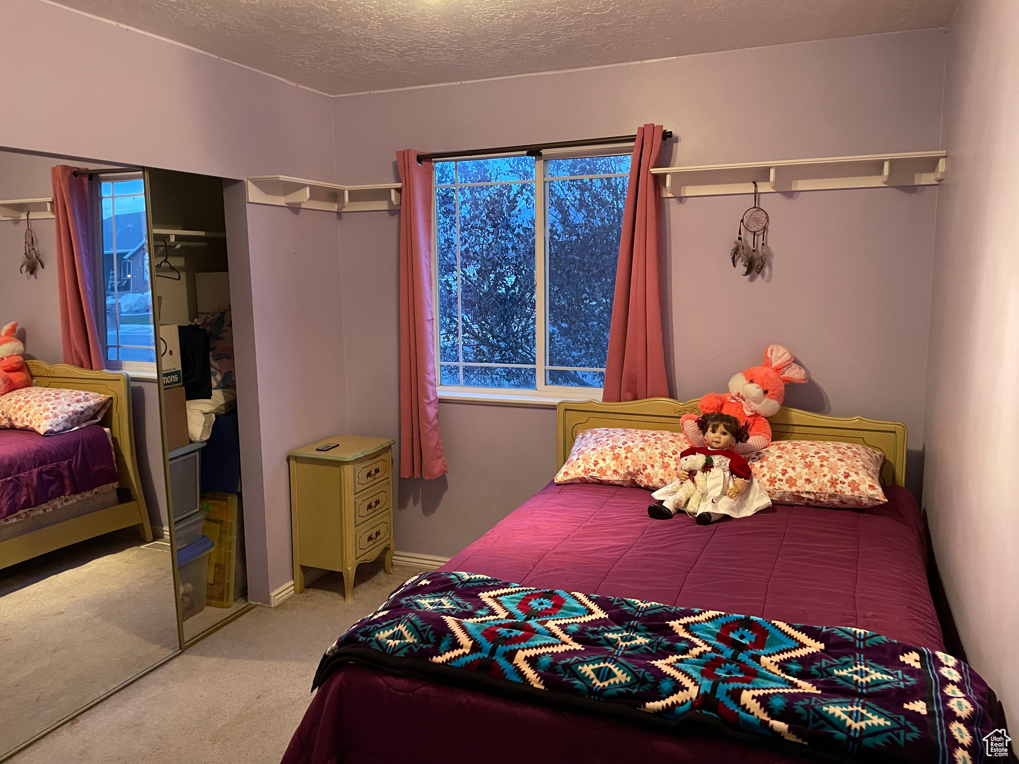 Carpeted bedroom and closet