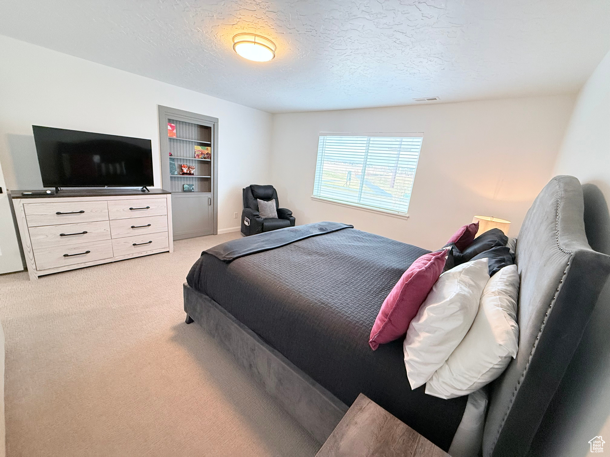 Primary Bedroom #1 on 2nd Floor featuring carpet floors and custom access door to primary bathroom suite