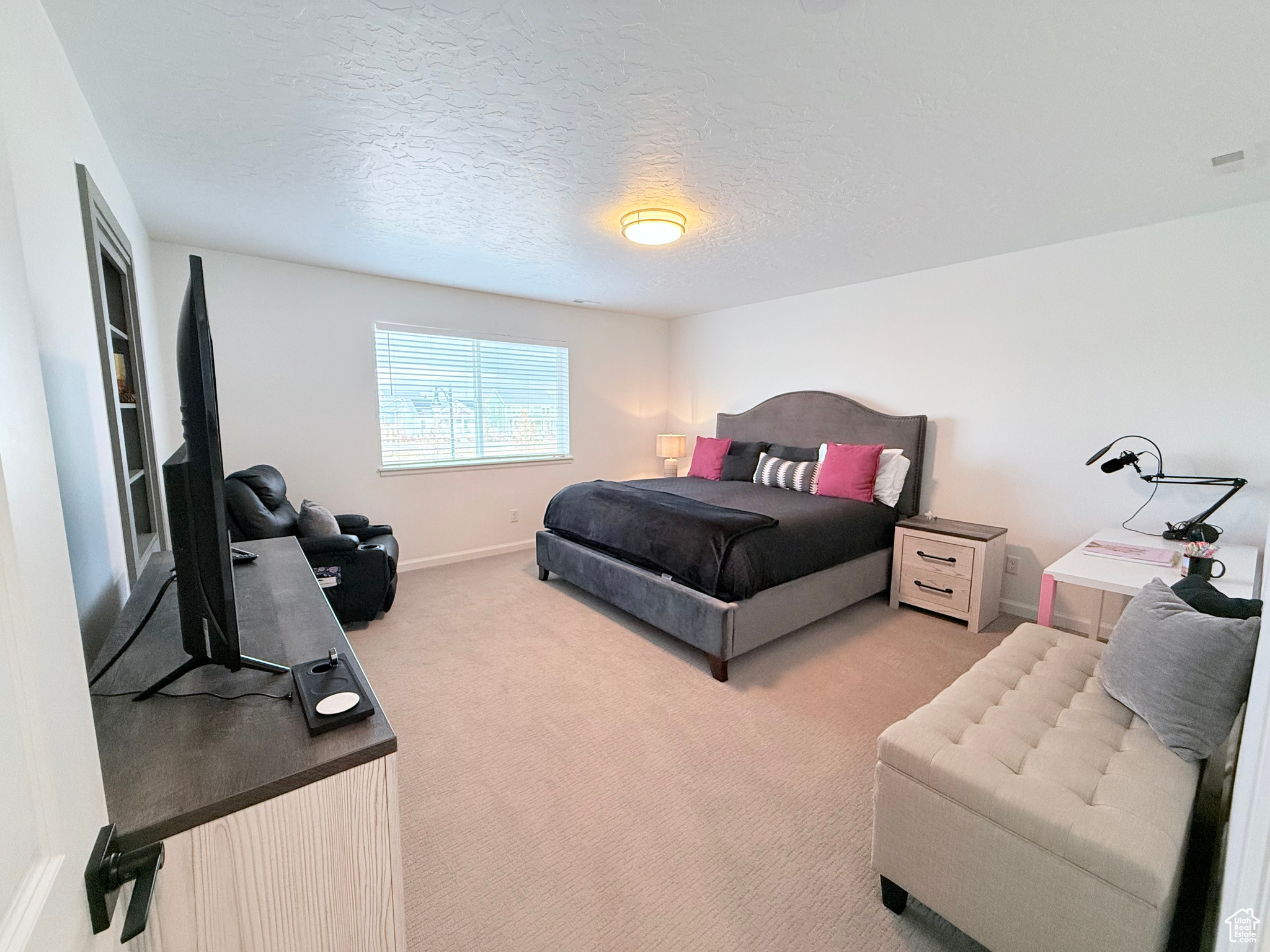 Primary Bedroom #1 on 2nd Floor featuring carpet floors and custom access door to primary bathroom suite