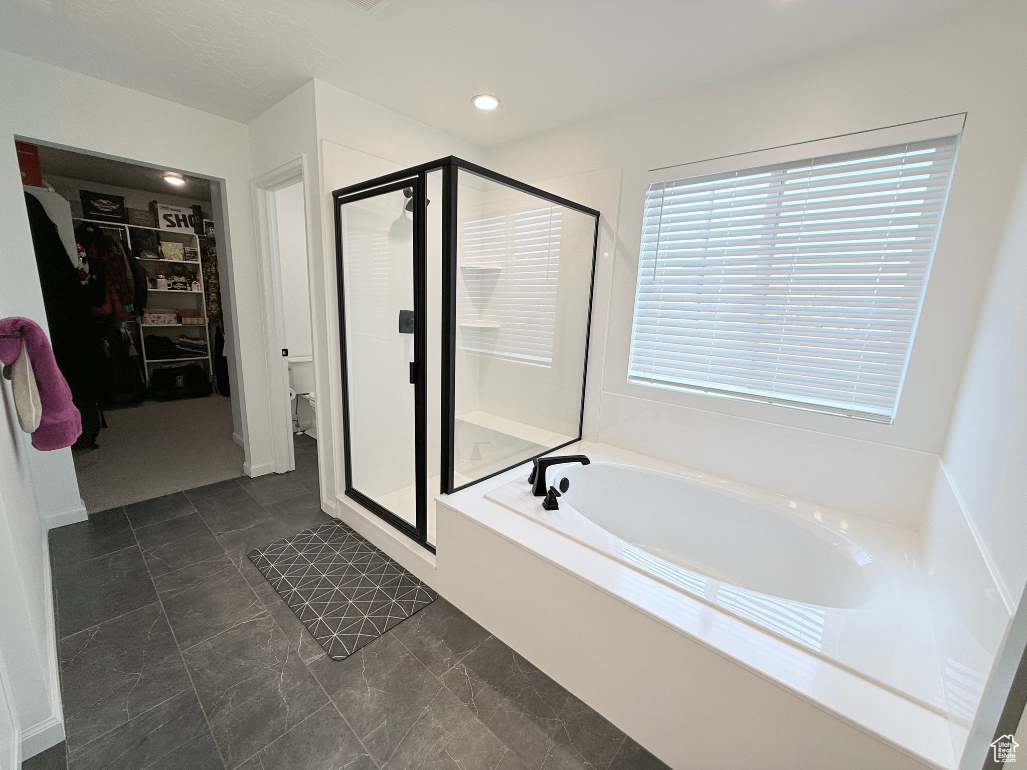 Bathroom on 2nd Floor with shower with separate oval soaker bathtub