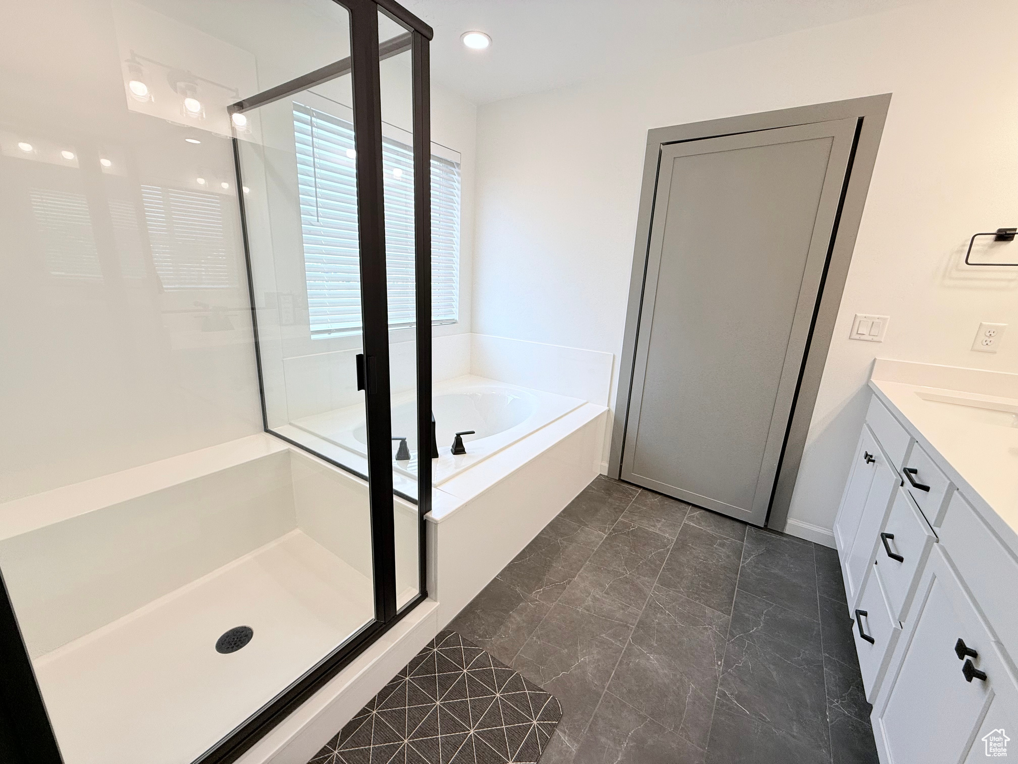 Primary Bathroom on 2nd Floor featuring vanity and shower with separate bathtub