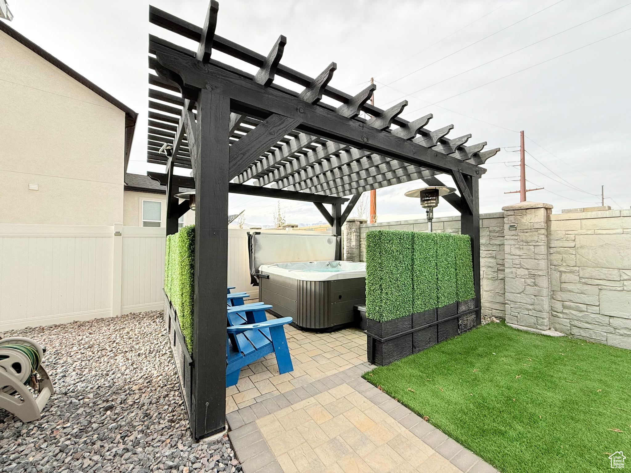 View of patio / terrace featuring a pergola and a hot tub