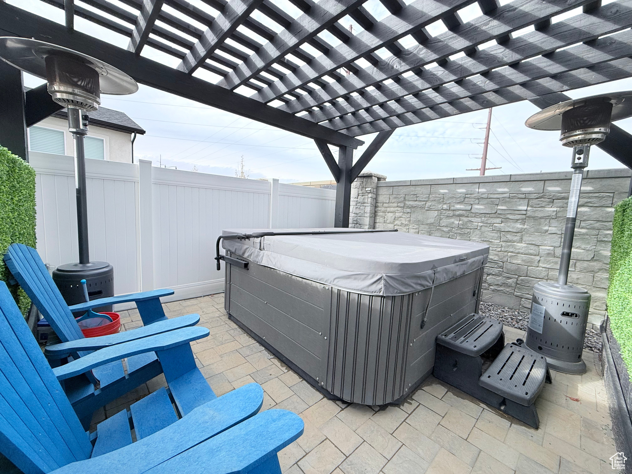 View of patio featuring a pergola and a hot tub