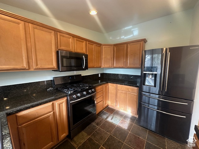 Kitchen with appliances with stainless steel finishes