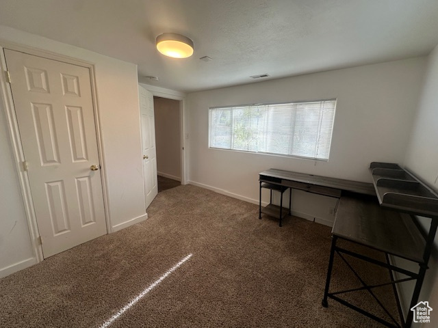 Office featuring dark colored carpet