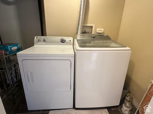 Clothes washing area featuring separate washer and dryer