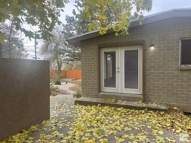 View of exterior entry featuring french doors