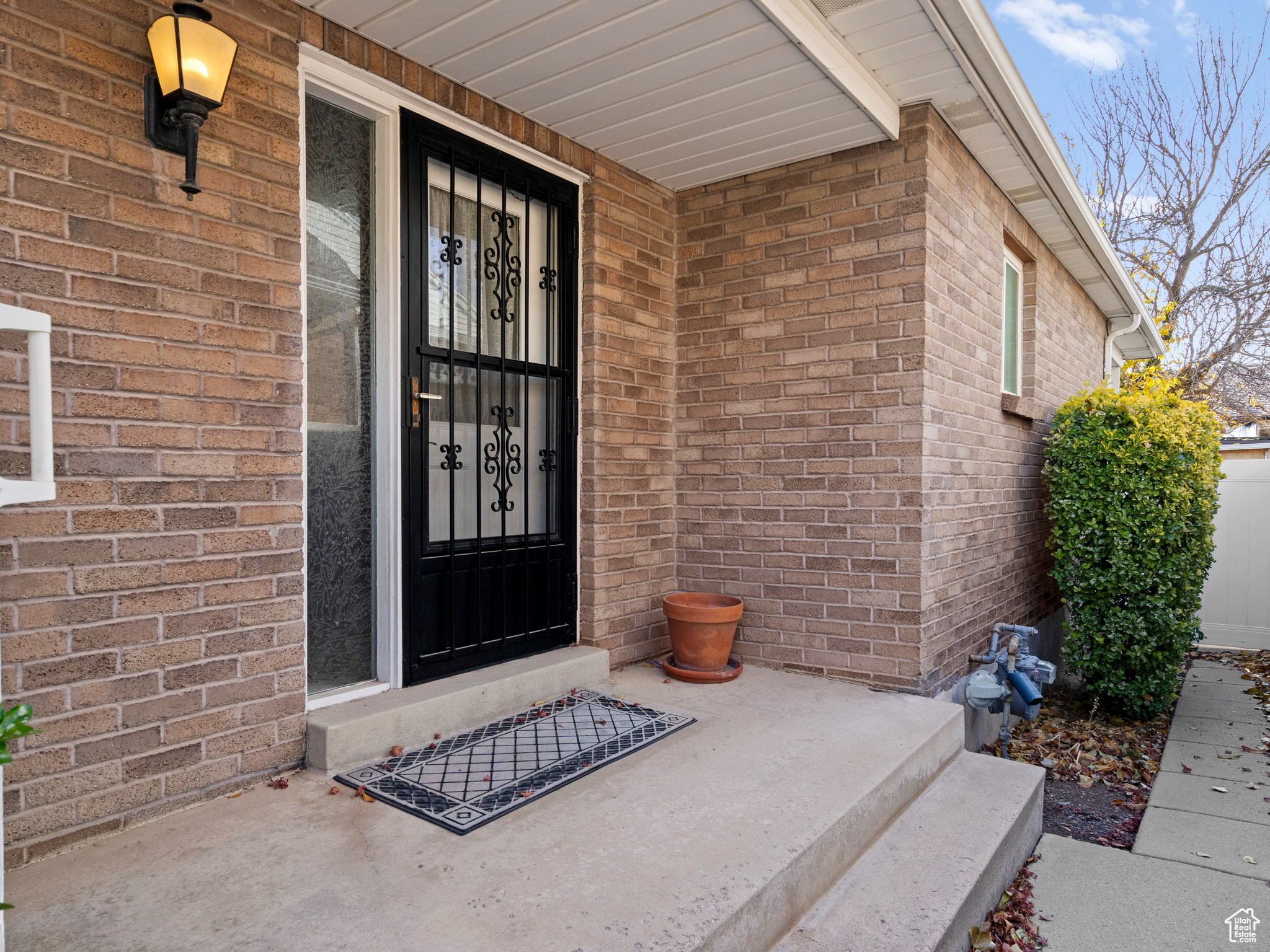 Doorway to property featuring a porch