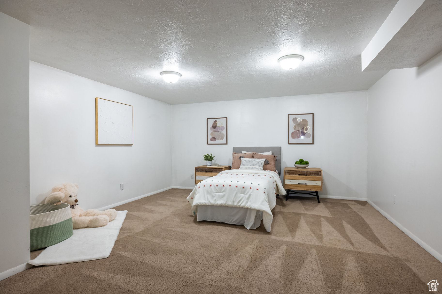 Carpeted bedroom featuring a textured ceiling