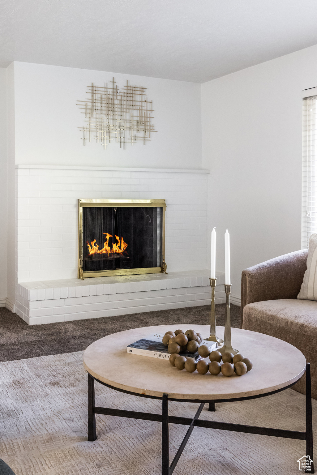 Carpeted living room featuring a fireplace